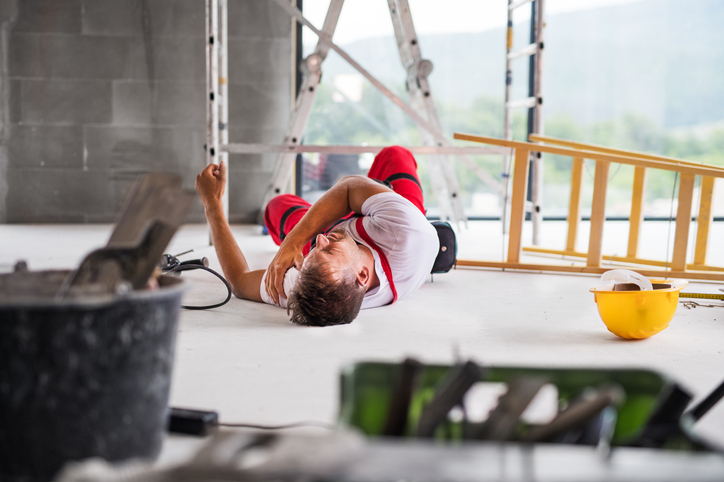 Injury at work Man fallen down from ladder at work with injury