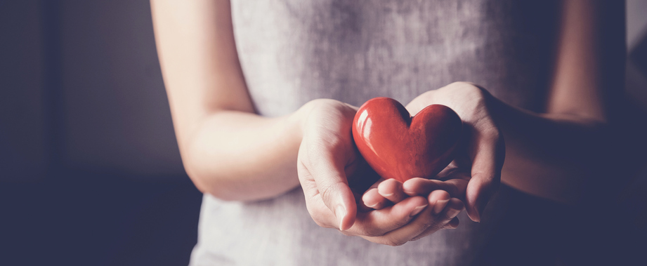 Woman holding hearts Woman holding hearts