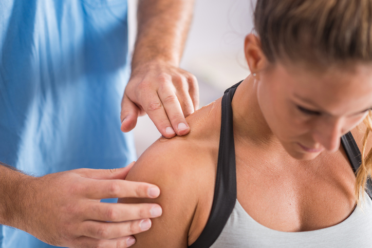 Physiotherapist manipulating should joint as treatment of shoulder pain Physiotherapist manipulating should joint as treatment of shoulder pain