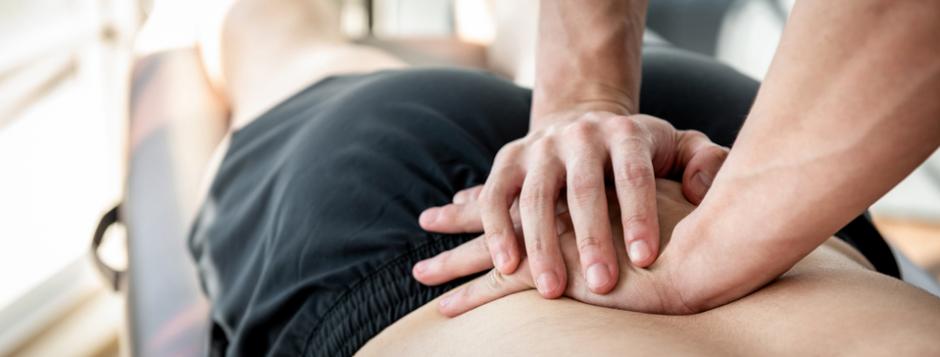 Physiotherapy for back pain Back pain patient receiving physiotherapy