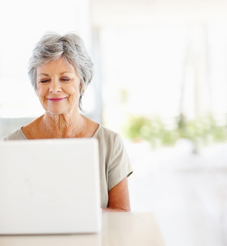 Lady having virtual physio consultation in front of computer