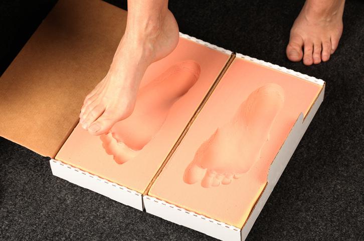 Patient taking a cast for custom orthotics Patient taking a cast for custom orthotics
