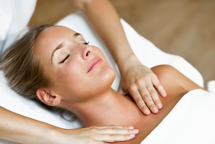 Female having shoulder and neck massage therapy